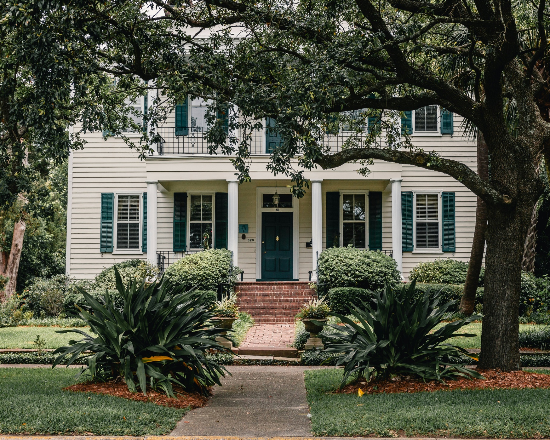 Classic Pensacola home with mature oak trees — the kind of property we protect from mold